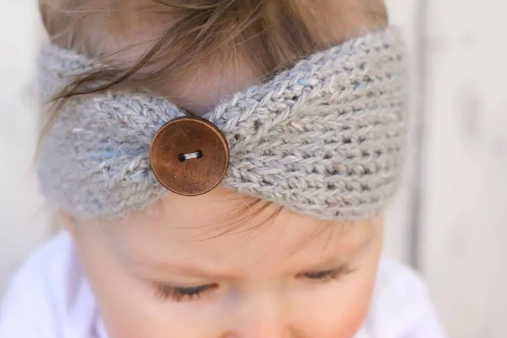 image of a baby with a tan headband
