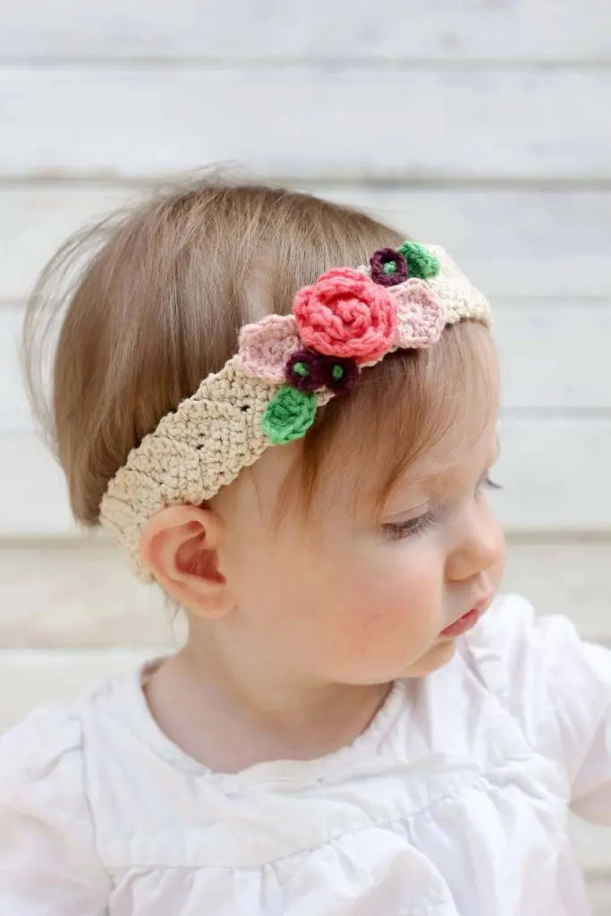 image of a baby with a crocheted bow headband