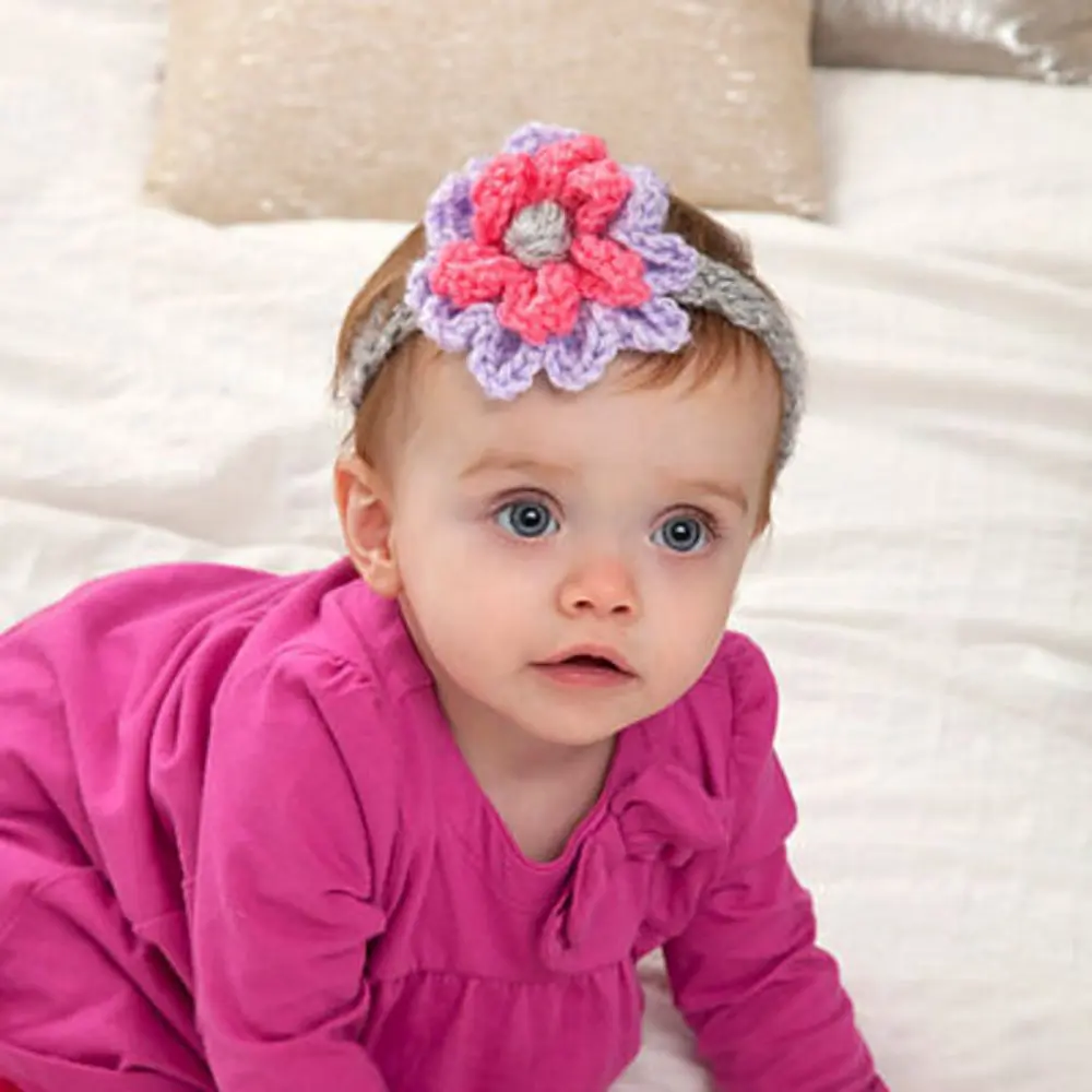 image of a baby with a flower headband