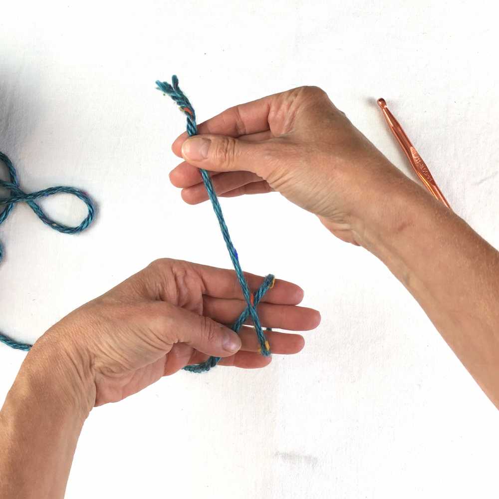 loop the yarn around fingers