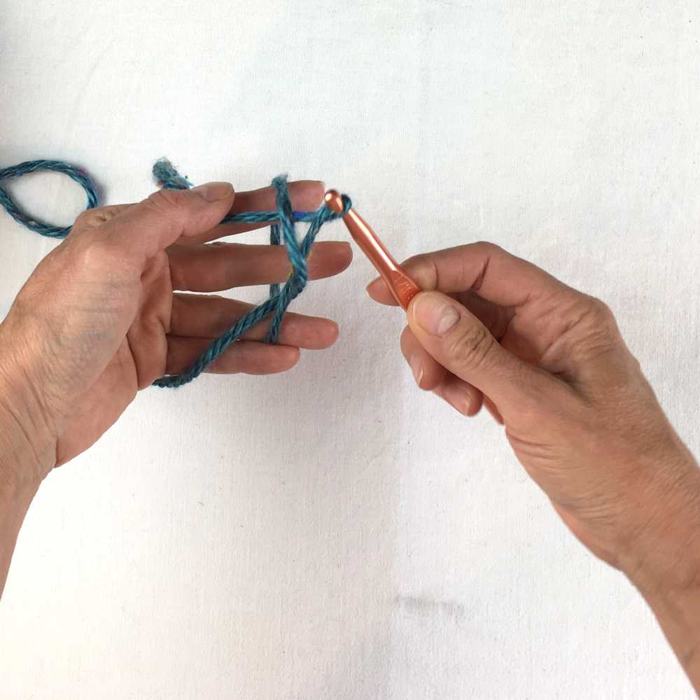 Pull yarn through loop with the crochet hook