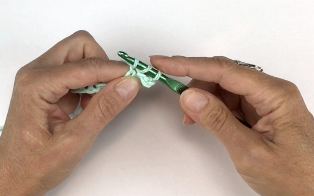 Three loops on crochet hook for the dc stitch