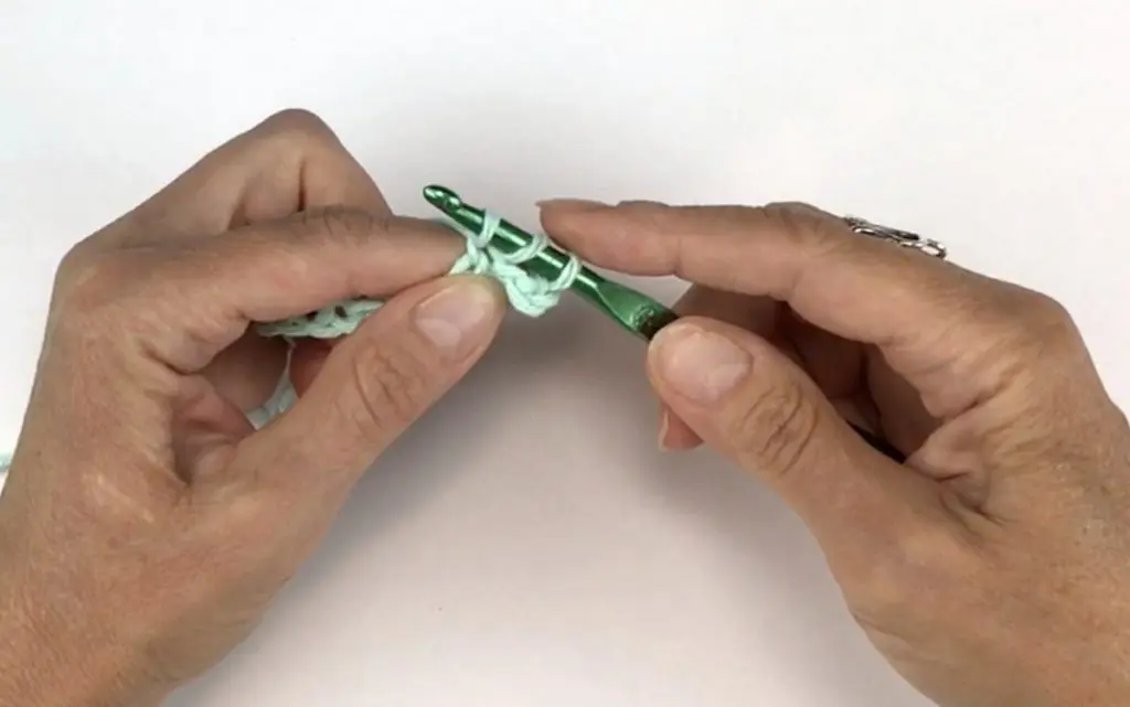 Three loops on crochet hook for the dc stitch