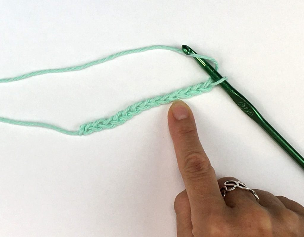 Inserting the crochet hook in a chain stitch
