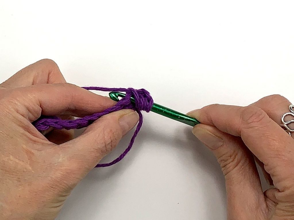 Inserting a crochet hook into a stitch