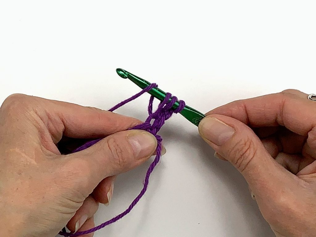 Crochet hook with three loops and one yarn over