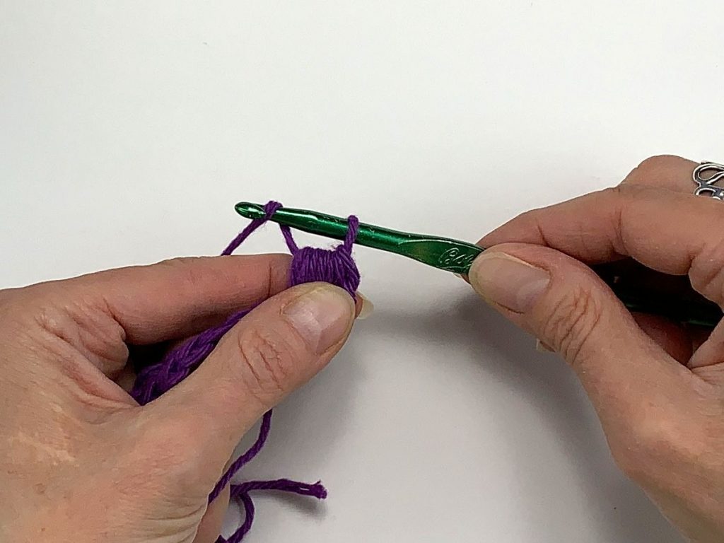 A loop on a crochet hook and a yarn over
