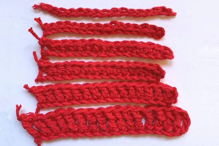 six rows of different crochet stitches in red yarn