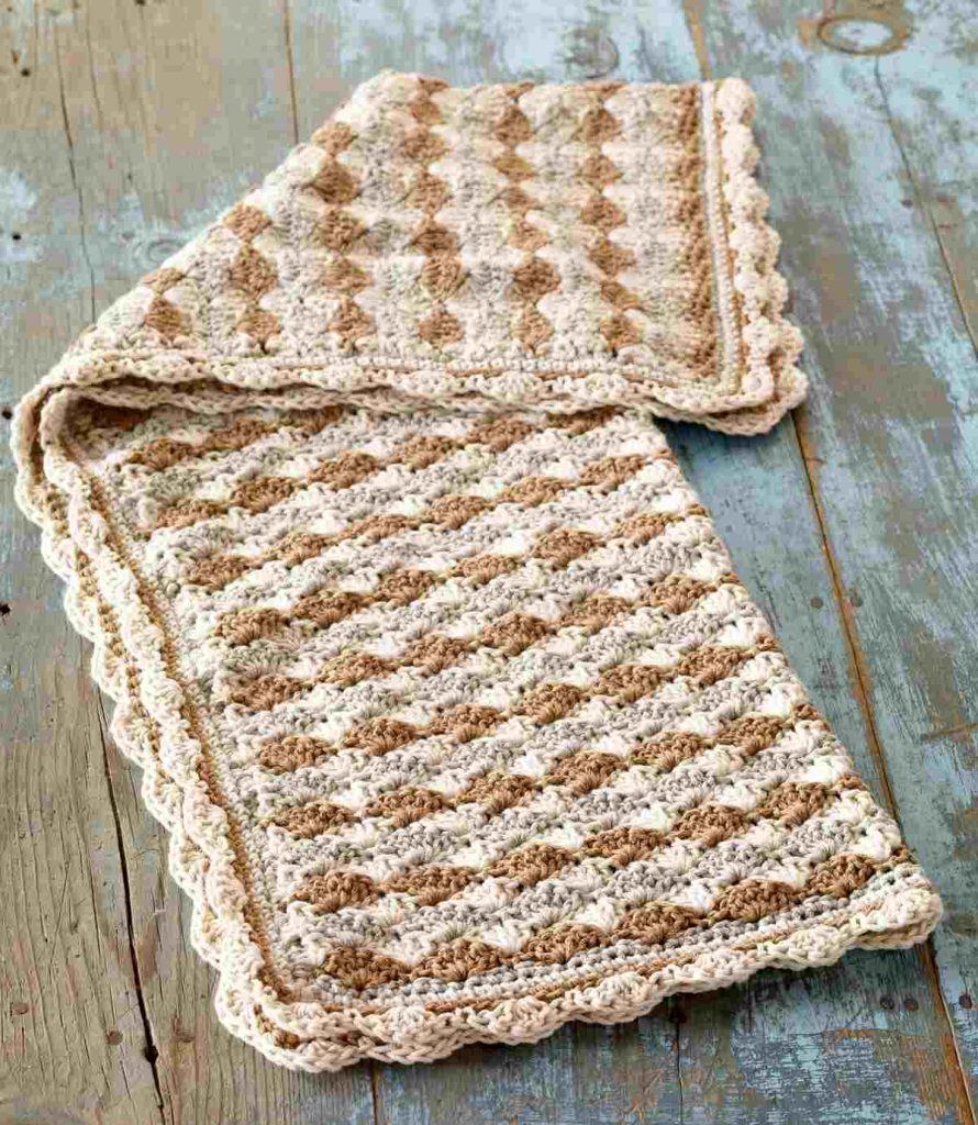 image of a light and medium brown striped afghan