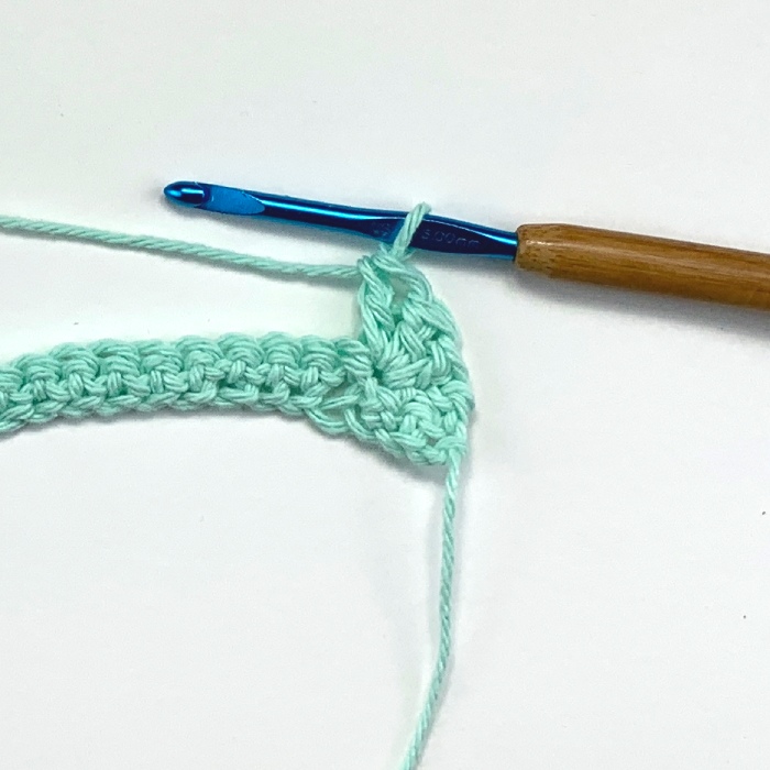 image of the 3rd double stitch in a crochet shell