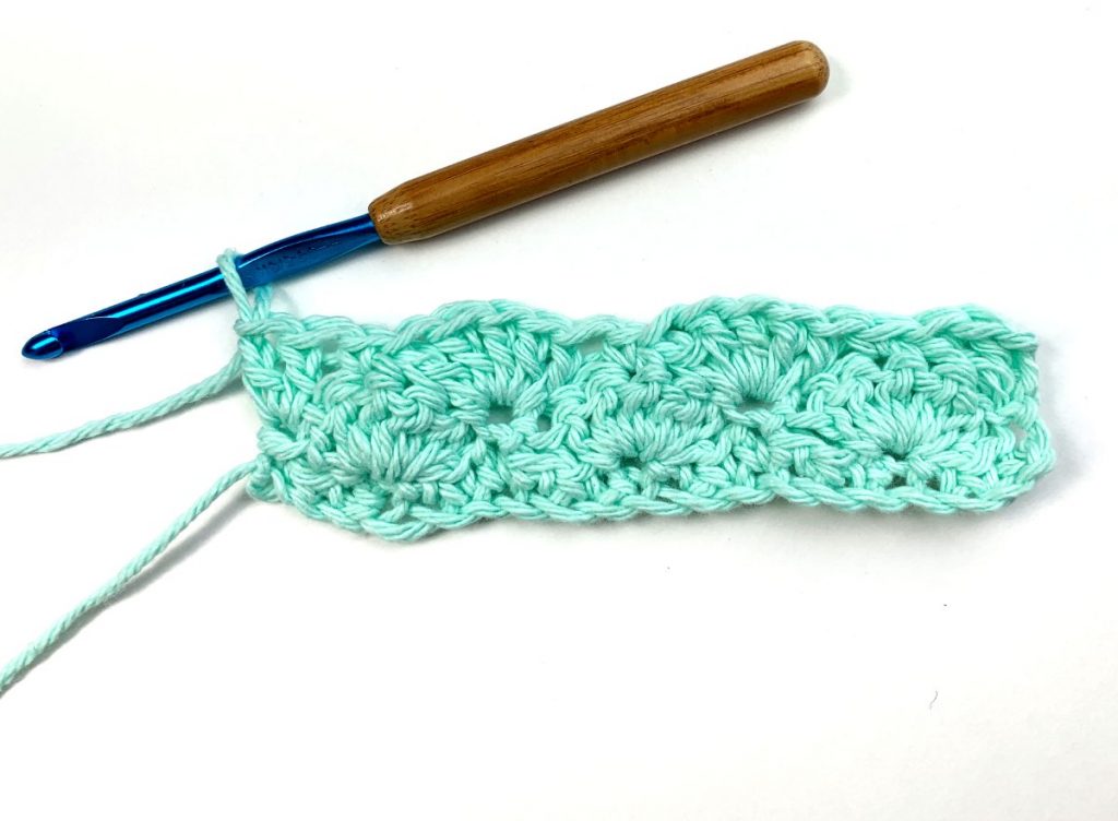 image of crochet work in turquoise yarn