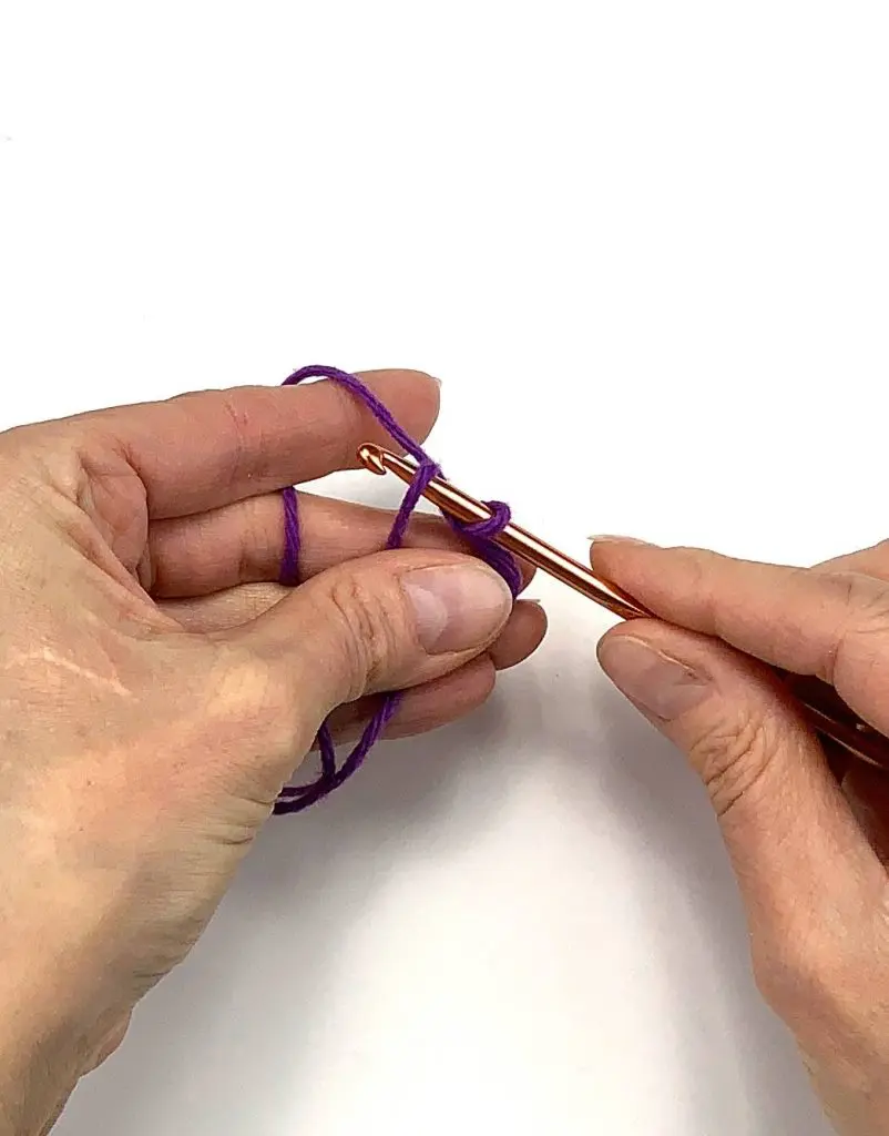 image of two hands crocheting