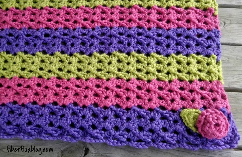 image of striped purple green and pink blanket