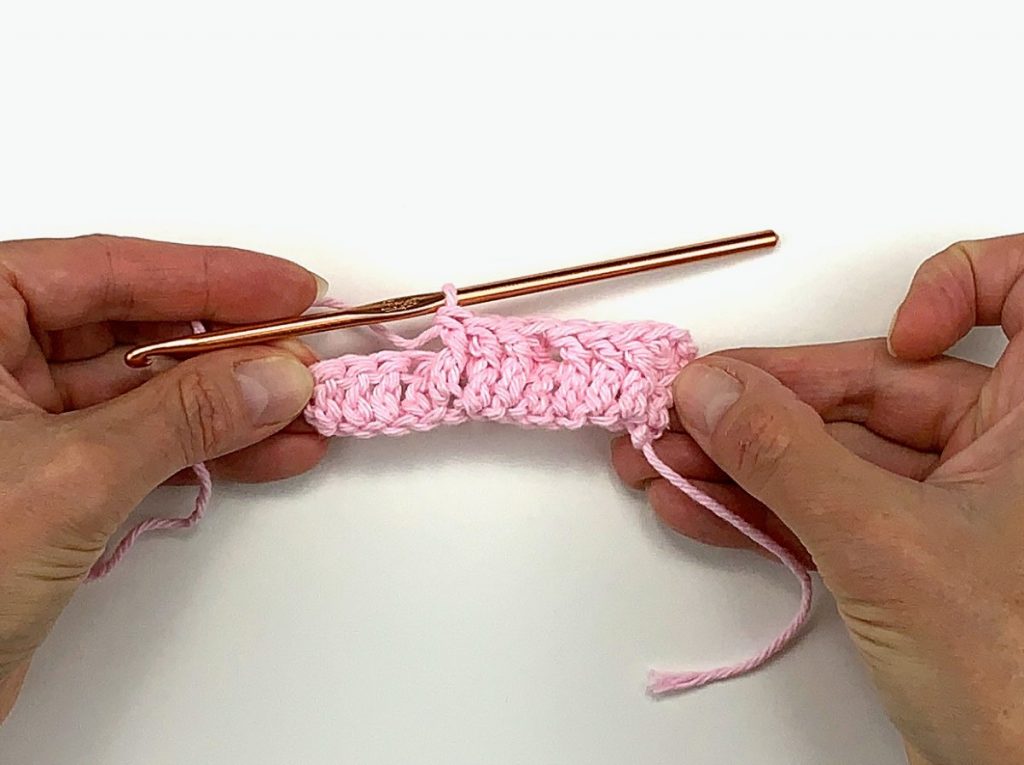 image of crochet waffle stitch in pink yarn