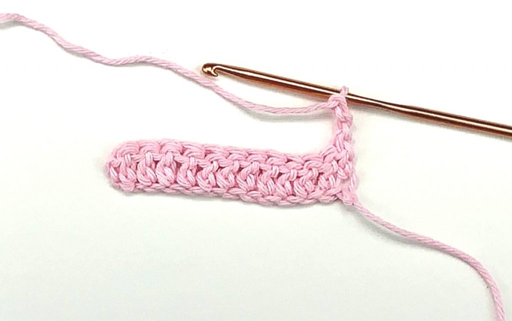 image of double crochet rows in pink yarn