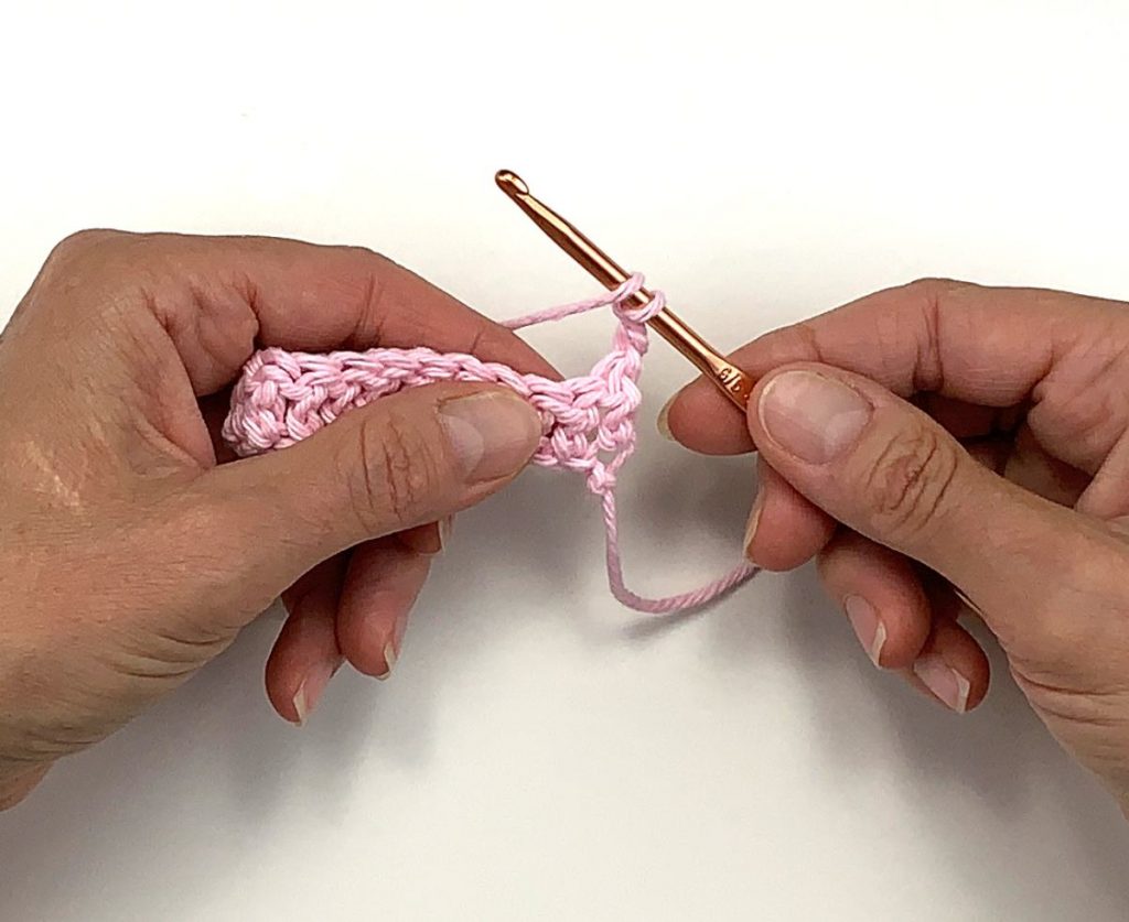 image of two hands crocheting